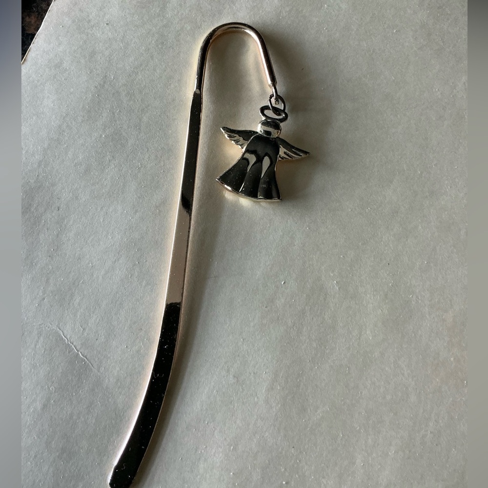 Metal bookmarked with angel.